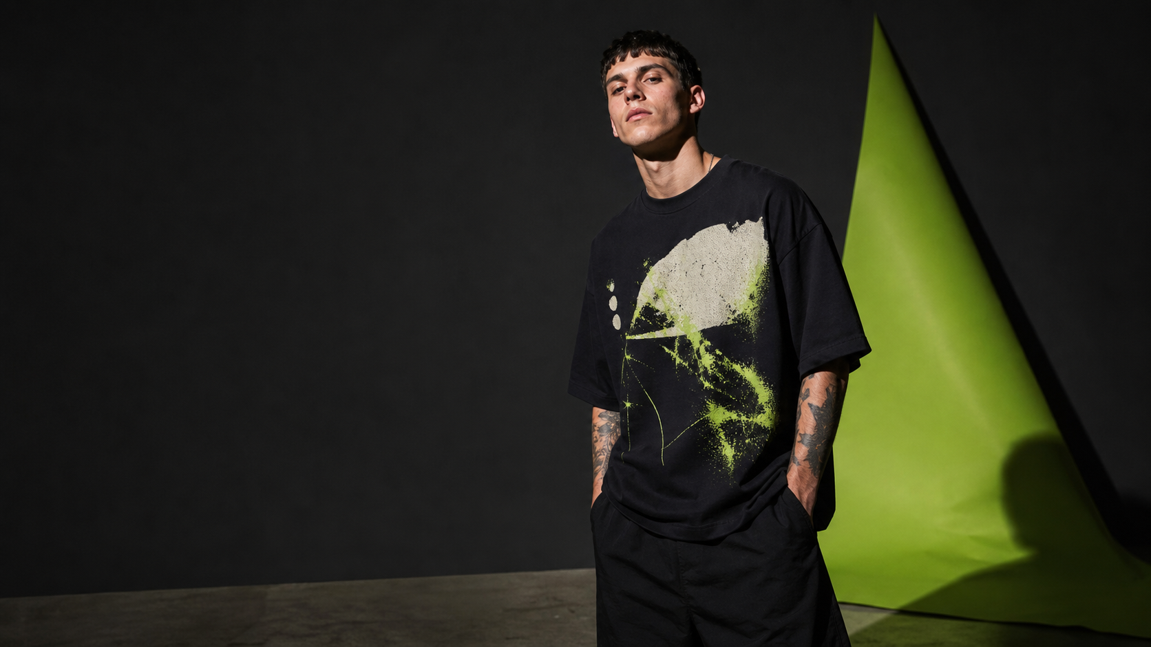 Custom graphic heavyweight T-shirt in a dark studio